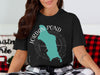 Black t-shirt with Jordan Pond Maine silhouette and compass graphic.