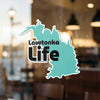 Turquoise map shape sticker with "Lawtonka Life" text and copyright.