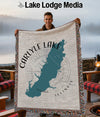 Throw blanket with Carlyle Lake Illinois map design, fringed edges.