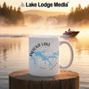 White mug with "PATOKA LAKE INDIANA" and compass design on a misty lake background.
