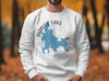 White sweatshirt with Shaver Lake, California map, compass design, and copyright text.