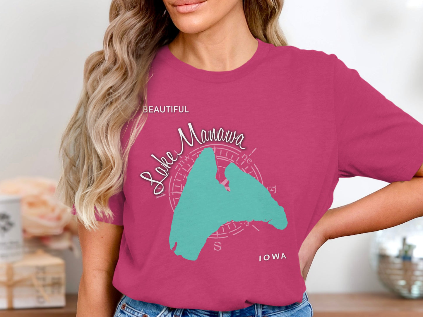 Pink t-shirt with "Lake Manawa Beautiful" text and map outline of Iowa.
