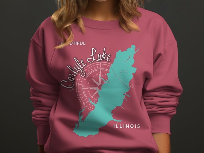 Pink sweatshirt with teal Carlysle Lake Illinois map and compass rose graphic.