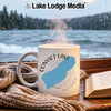White mug with Convict Lake California map, steaming hot beside a book.