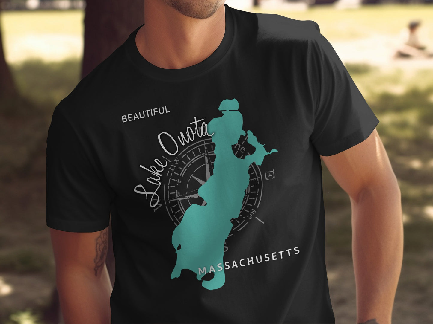Black t-shirt with a teal compass rose and Lake Quassa map of Massachusetts.