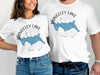 White t-shirts with Rangeley Lake map print and compass design.
