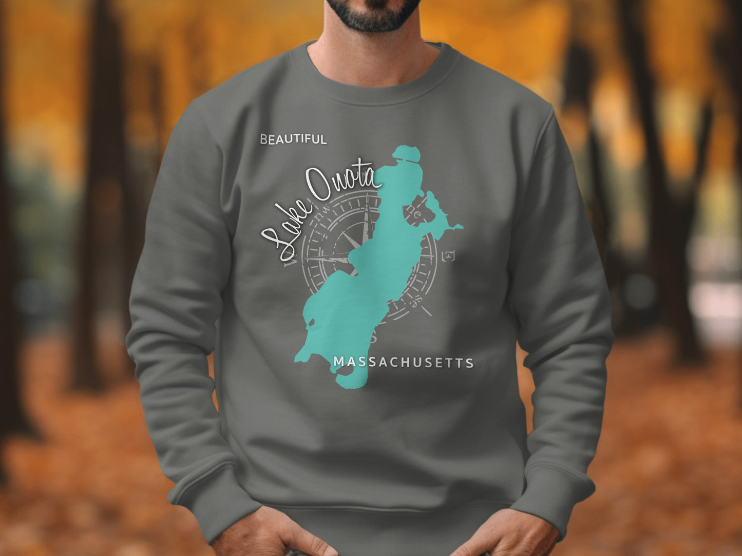 Gray sweatshirt with teal Lake Quota Massachusetts map and compass graphic.