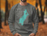 Gray sweatshirt with teal Lake Quota Massachusetts map and compass graphic.