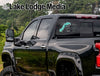 Turquoise sticker with "marble Falls Life" text on a black truck rear window.