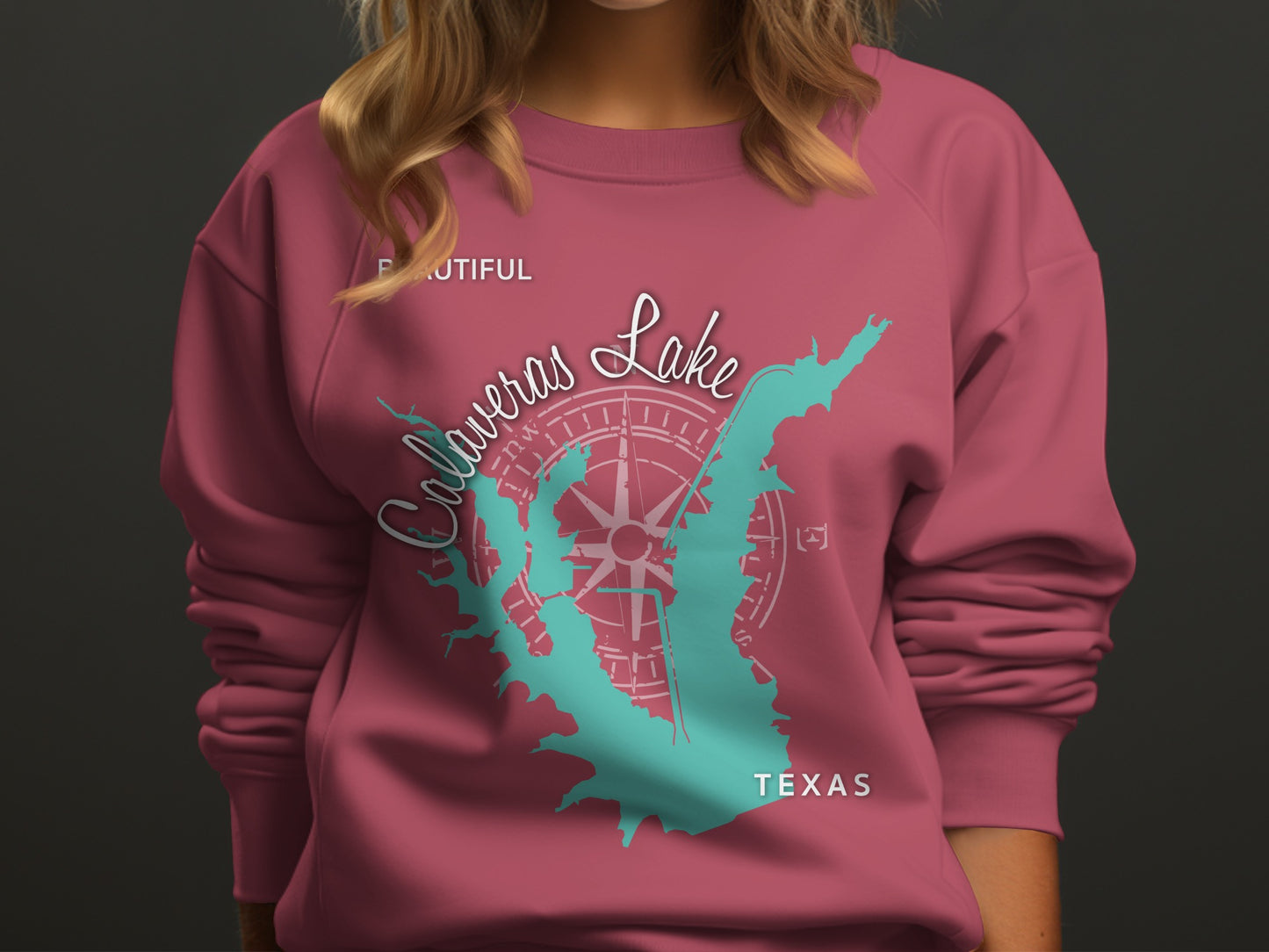 Pink sweatshirt with "Calaveras Lake Texas" and compass rose graphic.