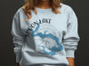 Light blue sweatshirt with Spoon Lake, Illinois map and compass graphic.