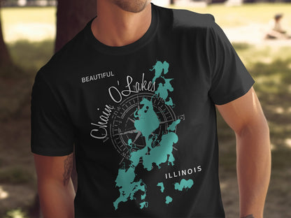 Black t-shirt with teal map of Chain O'Lakes Illinois and compass.