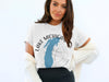 White t-shirt with Lake Michigan map and compass graphic.
