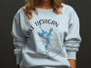 Light blue sweatshirt with "LAKE MICHIGAN WISCONSIN" text, map, and compass graphic.