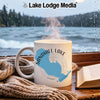 Mug with Sandhill Lake, Wisconsin graphic, by a window overlooking a lake.
