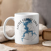 White mug with Little Grassy Lake Illinois map and compass design, steam rising.