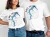 White t-shirts with "Lake Jacomo Missouri" and blue lake outline design.