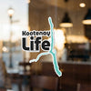 Kootenay Life sticker with a turquoise graphic of a lake over a blurred background.