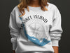 White sweatshirt with Sanibel Island map and compass rose graphic.