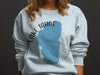 Light blue sweatshirt with Lake Tahoe map outline and compass graphic.