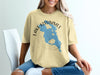 Yellow t-shirt with a blue map of Lake Kissimmee, Florida, and compass graphic.
