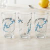 Three clear glasses with Logan Martin Lake map and compass designs.