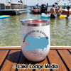 White insulated wine tumbler with a Manasquan Reservoir map design on a wooden boat deck.