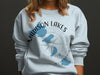 Light blue crewneck sweatshirt with "Madison Lakes Wisconsin" text and lake graphics.