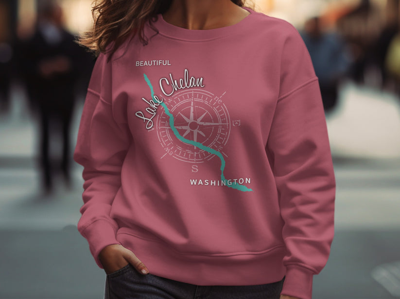 Pink sweatshirt with "Beautiful Lake Chelan Washington" and compass graphic.