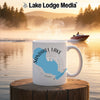 White mug with Sandhill Lake Wisconsin map graphic on a lake at sunrise.
