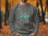 Grey sweatshirt with a compass rose design and "Beautiful Weiss Lake Alabama" text.