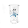Clear glass pint glass with Weiss Lake map and compass design.