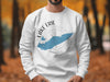 White sweatshirt with a blue outline of Lake Erie and compass rose design.