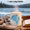 White mug with Sebago Lake map and Maine text, steaming, by window.