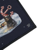 Bear in Santa hat with candy cane antlers in icy water near an anchor.