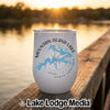 A white stainless steel wine tumbler with Mountain Island Lake North Carolina printed on it rests on a wooden dock at sunset.