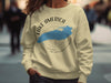 Light yellow crewneck sweatshirt with "Lake America" text and compass graphic.