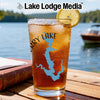 Glass of iced tea with blue map of Jerry Lake, lemon slice, and water in background.