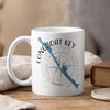 White mug with Longboat Key, Florida map and compass design.