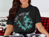 Black t-shirt with Lake Martin Alabama compass design and water graphic.
