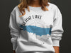 White sweatshirt with Oneida Lake map graphic and compassrose design.