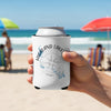 White can cooler with "Highland Lakes Texas" and compass on a beach.