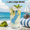 Glass of drink with lime and mint, Lake Onota, Massachusetts map on beach background.