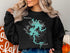 Black sweatshirt with "Lake Blue Ridge GEORGIA" map and compass graphic.