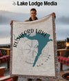 Rushford Lake New York map and compass design on a fringed throw blanket held by a person.