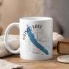 White mug with Otisco Lake map and compass graphic.