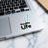Keuka Life sticker with teal outline on a laptop.