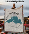 Man holding a blanket with Lake Superior map and "Minnesota" text.