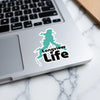 Turquoise Longview Life sticker on a laptop keyboard