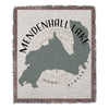 Woven blanket with a gray map outline of Mendenhall Lake, Alaska and compass graphic.